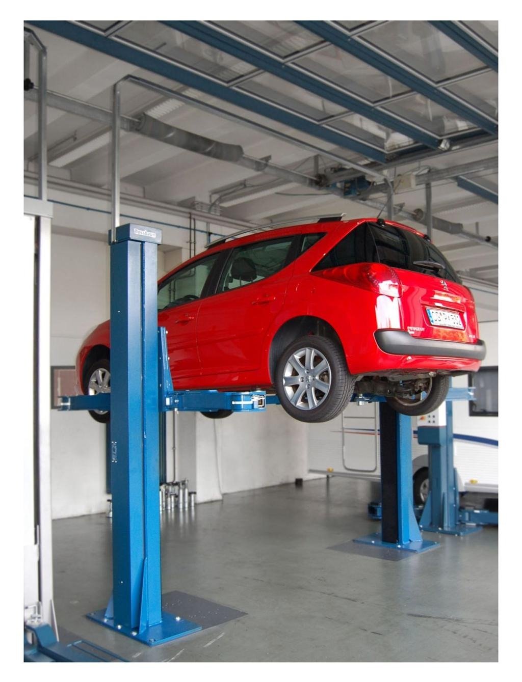 Two post vehicle lift in automotive workshop